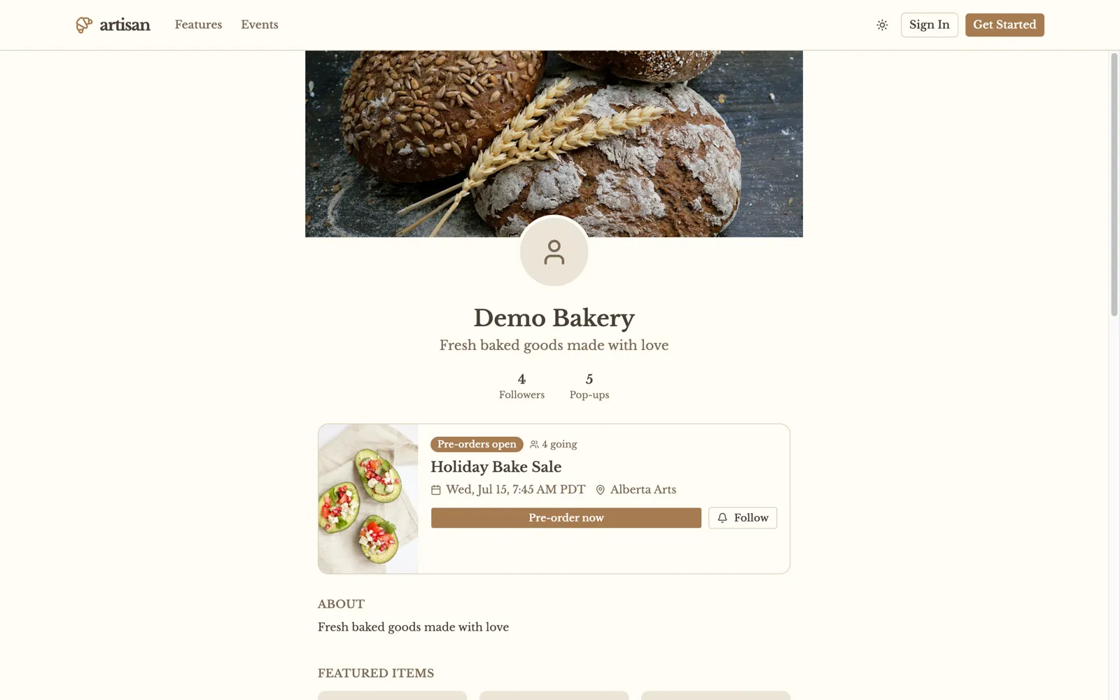 A bakery's storefront on Artisan — cover photo, an open pre-order, and featured items